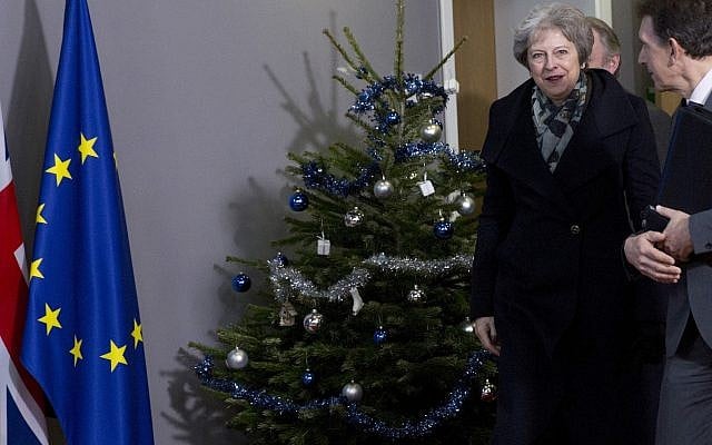 British Prime Minister Theresa May, center, walks past a holiday tree as she leaves the Europa building after a meeting with European Council President Donald Tusk in Brussels, December 11 2018. (Virginia Mayo/AP) British Prime Minister Theresa May, center, walks past a holiday tree as she leaves the Europa building after a meeting with European Council President Donald Tusk in Brussels, December 11 2018. (Virginia Mayo/AP)