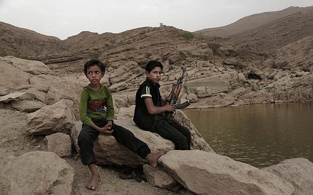 In this July 30, 2018, photo, a 17 year-old boy holds his weapon in High dam in Marib, Yemen (AP Photo/Nariman El-Mofty) In this July 30, 2018, photo, a 17 year-old boy holds his weapon in High dam in Marib, Yemen (AP Photo/Nariman El-Mofty)