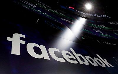In this March 29, 2018, file photo, the logo for Facebook appears on screens at the Nasdaq MarketSite in New York's Times Square.(AP Photo/Richard Drew,)
