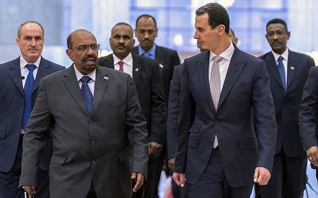 Syrian President Bashar Assad, left, meets with Sudan's President Omar al-Bashir in Damascus, Syria, December 16, 2018, in Damascus. (The Syrian official news agency, SANA via AP) Syrian President Bashar Assad, left, meets with Sudan's President Omar al-Bashir in Damascus, Syria, December 16, 2018, in Damascus. (The Syrian official news agency, SANA via AP)