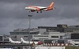 An EasyJet plane on its final approach before landing at Gatwick airport near London, on December 21, 2018. (John Stillwell/PA via AP)