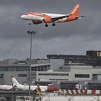 An EasyJet plane on its final approach before landing at Gatwick airport near London, on December 21, 2018. (John Stillwell/PA via AP)