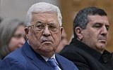 Palestinian Authority President Mahmoud Abbas, left, attends a Christmas midnight mass at Saint Catherine's Church in the Church of the Nativity, traditionally recognized by Christians to be the birthplace of Jesus, in the West Bank city of Bethlehem on December 25, 2018. (AP Photo/Nasser Nasser, Pool)