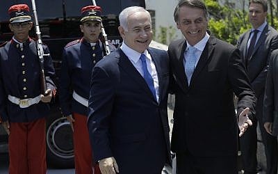 Israeli Prime Minister Benjamin Netanyahu, left center, is received by Brazil's President-elect Jair Bolsonaro at the military base Fort Copacabana, in Rio de Janeiro, Brazil, December 28, 2018.  (Leo Correa/Pool Photo via AP)