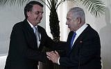 Brazil's President-elect Jair Bolsonaro, left, and Israel's Prime Minister Benjamin Netanyahu shake hands during a joint statement at the military base Fort Copacabana, in Rio de Janeiro, Brazil, Friday, Dec. 28, 2018. (Leo Correa/Pool Photo via AP)