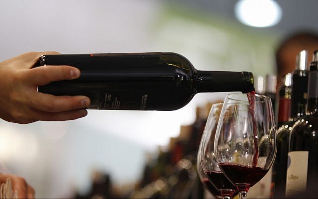Illustrative: A man pours a glass of red wine at the annual International Wine and Spirits Exhibition 'Vinitaly,' in Verona, northern Italy, on April 8, 2010. (AP Photo/Luca Bruno) Illustrative: A man pours a glass of red wine at the annual International Wine and Spirits Exhibition 'Vinitaly,' in Verona, northern Italy, on April 8, 2010. (AP Photo/Luca Bruno)
