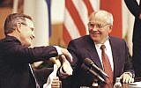 In this Sept. 9, 1990 file photo US President George H. W. Bush shakes hands with Soviet President Mikhail Gorbachev at the conclusion of their joint news conference ending the one day summit in Helsinki, Finland (AP Photo/Liu Heung Shin, file)