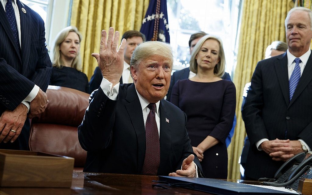President Donald Trump answers a reporter's question about the investigation of special counsel Robert Mueller during a signing ceremony of the "Cybersecurity and Infrastructure Security Agency Act," in the Oval Office of the White House, Friday, November 16, 2018, in Washington. (AP/Evan Vucci) President Donald Trump answers a reporter's question about the investigation of special counsel Robert Mueller during a signing ceremony of the "Cybersecurity and Infrastructure Security Agency Act," in the Oval Office of the White House, Friday, November 16, 2018, in Washington. (AP/Evan Vucci)