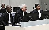ICC's prosecutor Fatou Bensouda, right, and deputy prosecutor James Stewart, center, at the International Criminal Court, ICC, in The Hague, Netherlands, Friday Nov. 23, 2018. (Piroschka van de Wouw/pool/AP)