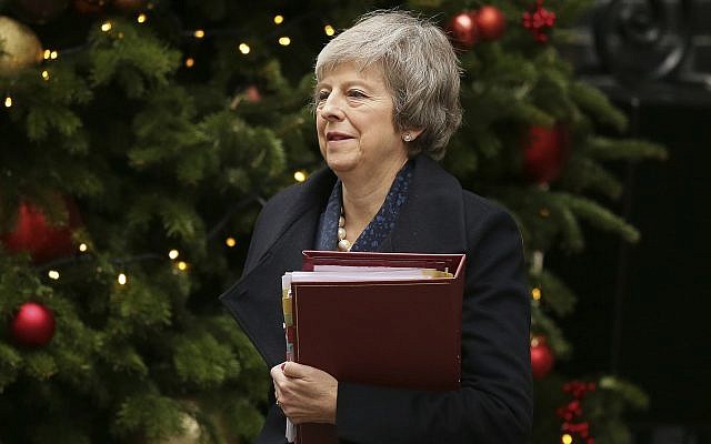 Britain's Prime Minister Theresa May leaves 10 Downing Street to attend the weekly Prime Ministers' Questions session, at parliament in London, Dec. 12, 2018 (AP Photo/Tim Ireland)