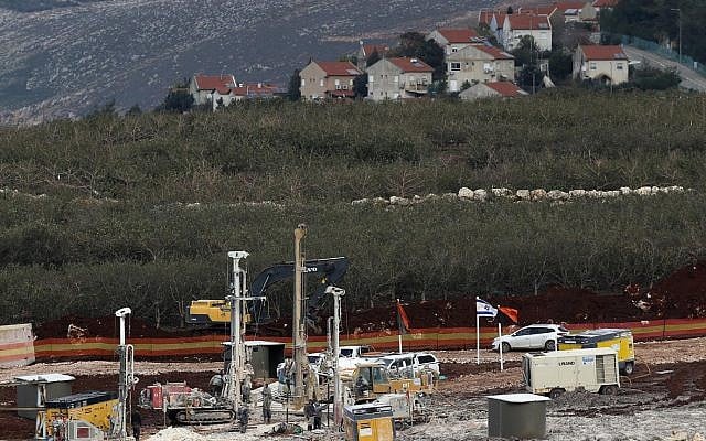 In this Thursday, Dec. 13, 2018 photo, Israeli military equipment works on the Lebanese-Israeli border in front of the Israeli town of Metula, background, near the southern village of Kafr Kila, Lebanon (AP Photo/Hussein Malla) In this Thursday, Dec. 13, 2018 photo, Israeli military equipment works on the Lebanese-Israeli border in front of the Israeli town of Metula, background, near the southern village of Kafr Kila, Lebanon (AP Photo/Hussein Malla)