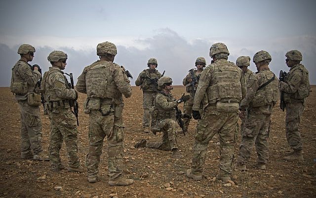 US soldiers gather for a brief during a combined joint patrol rehearsal in Manbij, Syria, November 7, 2018. (US Army photo by Spc. Zoe Garbarino via AP) US soldiers gather for a brief during a combined joint patrol rehearsal in Manbij, Syria, November 7, 2018. (US Army photo by Spc. Zoe Garbarino via AP)