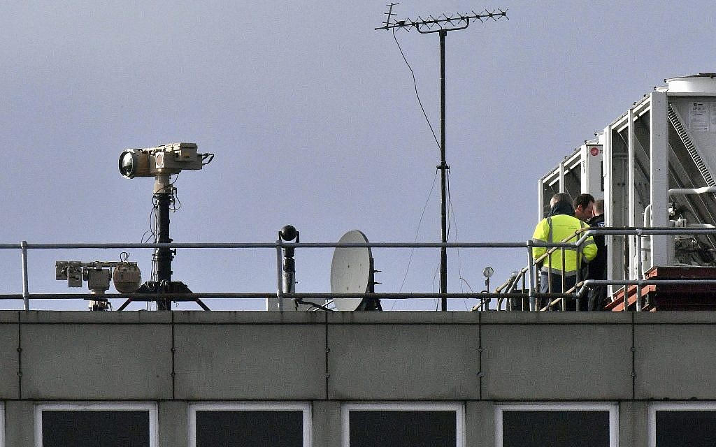 Counter drone equipment is deployed on a rooftop at Gatwick airport in Gatwick, England, December 21, 2018 (John Stillwell/PA via AP)
