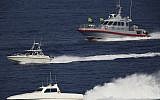 Illustrative: Patrol boats belonging to Iran's Islamic Revolutionary Guard Corps shadow the USS John C. Stennis aircraft carrier on December 21, 2018 (AP /Jon Gambrell)