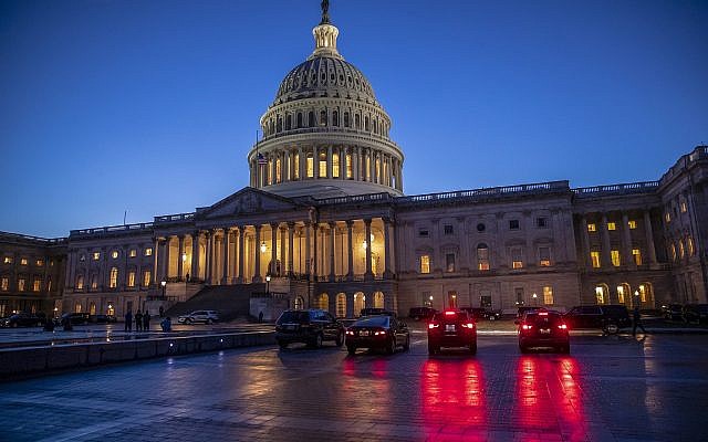 The Capitol is seen at day's end as the Senate works on a House-passed bill that would pay for President Donald Trump's border wall and avert a partial government shutdown, at the Capitol in Washington, December 21, 2018. (AP Photo/J. Scott Applewhite) The Capitol is seen at day's end as the Senate works on a House-passed bill that would pay for President Donald Trump's border wall and avert a partial government shutdown, at the Capitol in Washington, December 21, 2018. (AP Photo/J. Scott Applewhite)