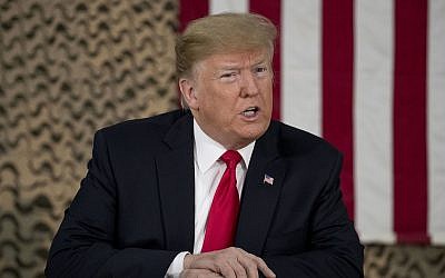 President Donald Trump speaks to members of the media at Al Asad Air Base, Iraq, December 26, 2018. (AP Photo/Andrew Harnik)