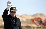 In this photo from February 22, 2015, provided by the Egyptian Presidency, Egyptian President Abdel-Fattah el-Sissi waves during a visit to the Suez Canal in Ismailia, Egypt. (Egyptian Presidency via AP, File)