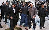Illustrative: This Tuesday, April 15, 2014, file photo provided by ISNA, a semi-official news agency, shows blindfolded Iranian convicted man Bilal being escorted by officials and security to be prepared for his execution in public in the northern city of Nour, Iran. (AP/ISNA, Arash Khamoushi)