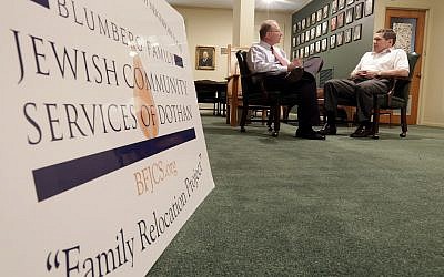 In this Wednesday, October 2, 2013, photo, Larry Blumberg, right, founder of Blumberg Family Jewish Community Services of Dothan, and the program's, executive director, Rob Goldsmith, discuss their relocation program at the Temple Emanu-El in Dothan, Alabama. (AP/Dave Martin)