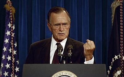 President Bush gestures during a news conference at the White House in Washington, Thursday, Sept. 12, 1991. The president declared that he would use his veto power if necessary to delay action on Israel's call for $10 billion in loan guarantees to help house Soviet immigrants. (AP/Greg Gibson)