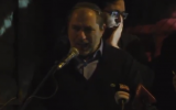 Chaim Silberstein speaks outside the Prime Minister's Residence in Jerusalem at a right-wing rally protesting the government's response to recent terror attacks in the West Bank, on December 13, 2018. (Screen capture: Twitter)