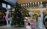 Illustrative: A display in the Big Fashion Mall complex in Ashdod, Israel, includes a menorah and a Christmas tree. (Courtesy)