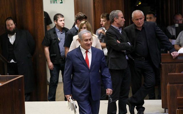 Prime Minister Benjamin Netanyahu arrives at a vote on the ultra-Orthodox draft bill at the assembly hall of the Knesset in Jerusalem on July 3, 2018. (Noam Revkin Fenton/Flash90) Prime Minister Benjamin Netanyahu arrives at a vote on the ultra-Orthodox draft bill at the assembly hall of the Knesset in Jerusalem on July 3, 2018. (Noam Revkin Fenton/Flash90)