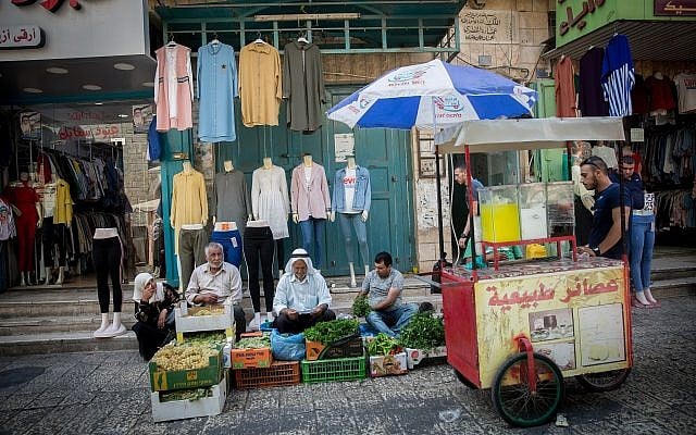 Palestinians shop at a vegetable market in the West Bank city of Bethlehem, August 30, 2018 (Miriam Alster/FLASH90) Palestinians shop at a vegetable market in the West Bank city of Bethlehem, August 30, 2018 (Miriam Alster/FLASH90)