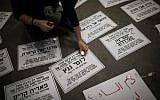 Women light candles during a rally protesting violence against women in Jerusalem, November 27, 2018 (Hadas Parush/Flash90)