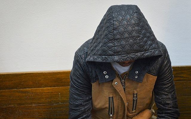 Eritrean national Tesfebarhan Tesfasion arrives for a court hearing at the Tel Aviv Magistrate's Court on November 29, 2018. (Flash90) Eritrean national Tesfebarhan Tesfasion arrives for a court hearing at the Tel Aviv Magistrate's Court on November 29, 2018. (Flash90)