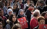 Women shout slogans and holding signs at Safra Square in Jerusalem as they protest against violence against women, December 4, 2018 (Hadas Parush/Flash90)