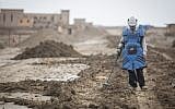 A man searches for mines near the site of Qasr al Yahud, the place where Jesus is believed to have been baptized, near the West Bank town of Jericho, on December 9, 2018. (Hadas Parush/Flash90)