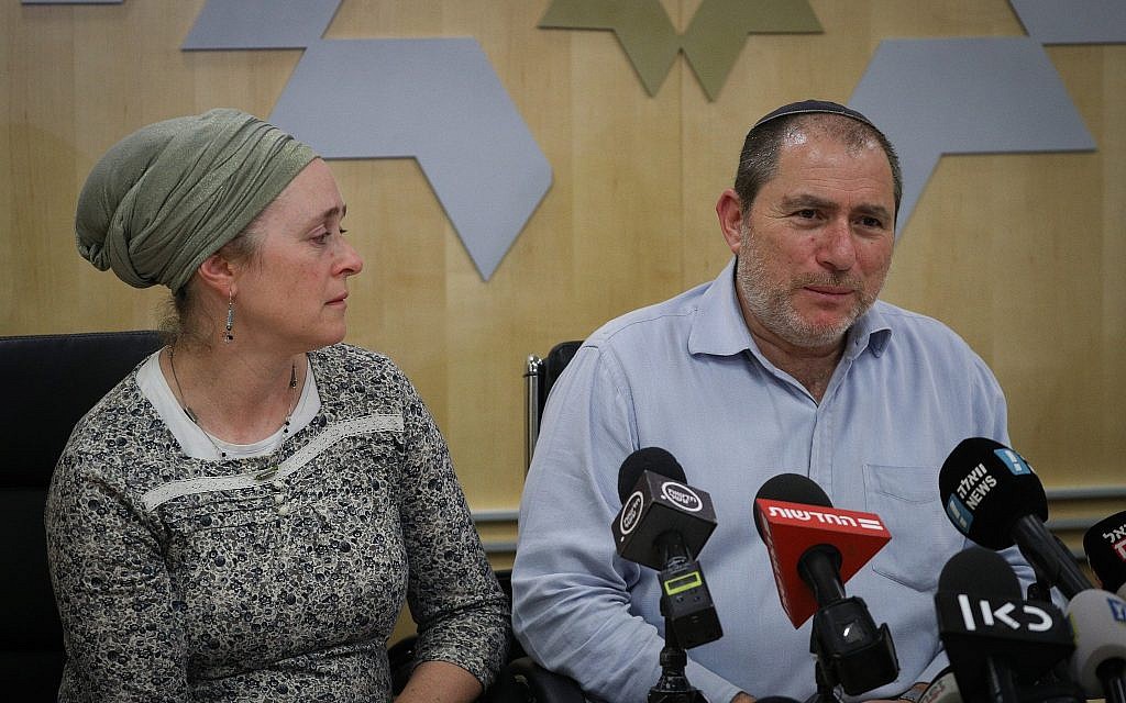 The parents of the pregnant Israeli woman critically injured in a terror attack in the West Bank speak to reporters at Shaarei Zedek hospital on December 10, 2018. (Yonatan Sindel/FLASH90)
