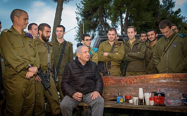 Prime Minister Benjamin Netanyahu speaks with soldiers during a visit to the Northern Command base in Safed, December 11, 2018 (Basel Awidat/Flash90) Prime Minister Benjamin Netanyahu speaks with soldiers during a visit to the Northern Command base in Safed, December 11, 2018 (Basel Awidat/Flash90)