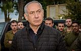 Prime Minister Benjamin Netanyahu speaks with Israeli soldiers during his visit at the Northern Command base in Safed, December 11, 2018. (Basel Awidat/Flash90)