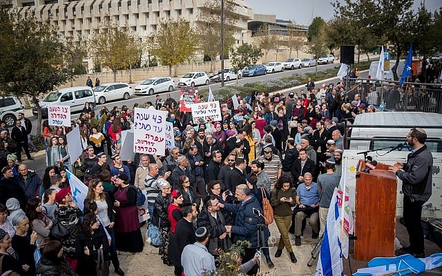 Settlers and right-wing activists protest against the ongoing terror attacks against Israelis in the West Bank outside the Prime Minister's Office in Jerusalem, on December 16, 2018. (Yonatan Sindel/Flash90) Settlers and right-wing activists protest against the ongoing terror attacks against Israelis in the West Bank outside the Prime Minister's Office in Jerusalem, on December 16, 2018. (Yonatan Sindel/Flash90)