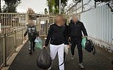 Illustrative: Prisoners leave Maasiyahu Prison in Ramle on December 20, 2018, after the state released 970 prisoners from prisons as part of a High Court of Justice decision. (Avi Dishi/Flash90)