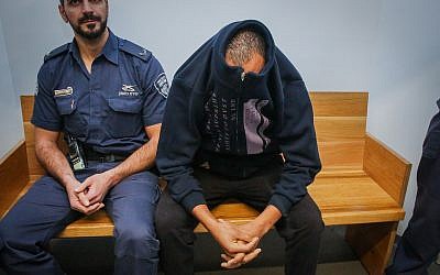 Eritrean national Tesfebarhan Tesfasion arrives for a court hearing at the Tel Aviv District Court on December 27, 2018. (Flash90)