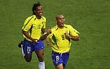 Ronaldo (left) of Brazil celebrates scoring the equalizing goal against Turkey with team mate Ronaldinho during the World Cup Group in Ulsan, South Korea on June 3, 2002. (Clive Brunskill/Getty Images)
