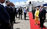 Prime Minister Benjamin Netanyahu (R) and his wife Sara take part in a welcoming ceremony upon their arrival in Rio De Janeiro, Brazil, on December 28, 2018. Third-to-left is Brazilian MP Eduardo Bolsonaro, the son of President-elect Jair Bolsonaro. (Avi Ohayon/GPO)