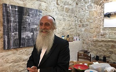 Artist Yoel Tordgman, a French-born artist whose life in Safed infuses his work, like many others who live in the Galilean city (Jessica Steinberg/Times of Israel)