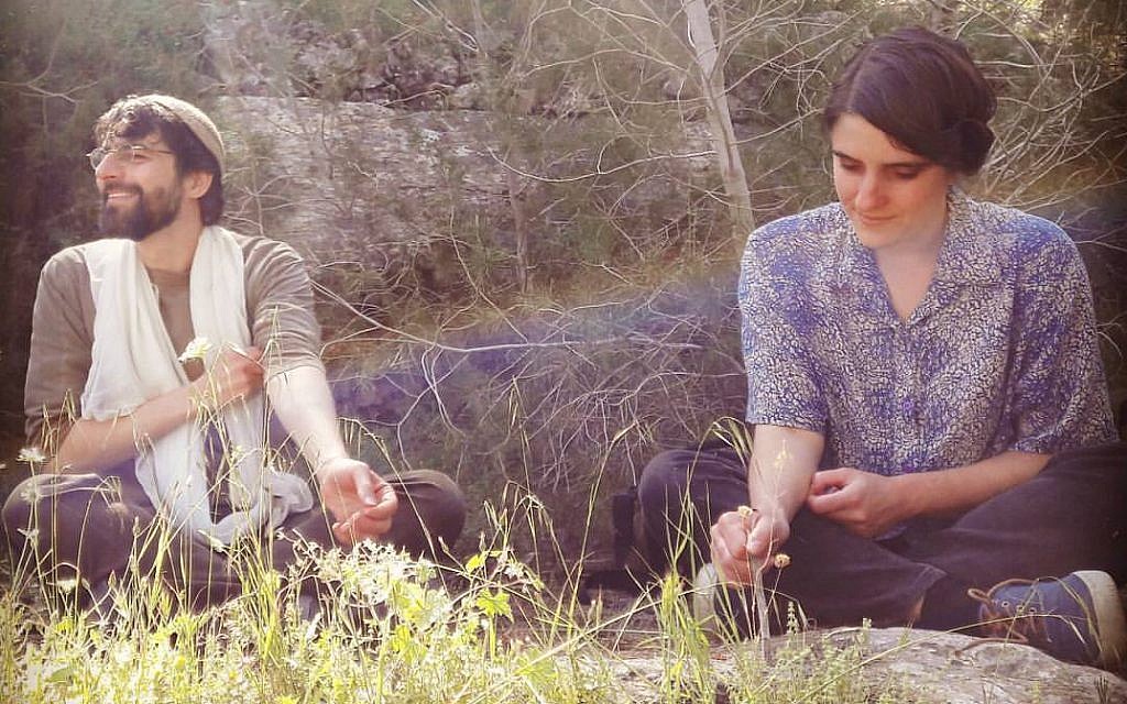Achvat Amim participants learning Jewish topics in the forest. (Courtesy Achvat Amim)