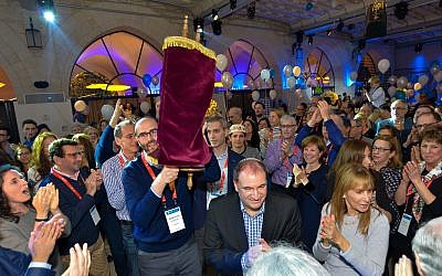 Members and leadership of Park Avenue Synagogue celebrate their congregation's donation of a Torah to the Israeli Masorti Movement for use at the Ezrat Yisrael section of the Kotel, Jerusalem, December 26, 2018. (BGAP2008)