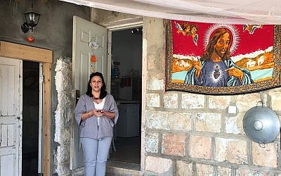 Rima Khoury in front of the Beit Rima cultural center in Fassuta. (Federico Maccioni/ Times of Israel)