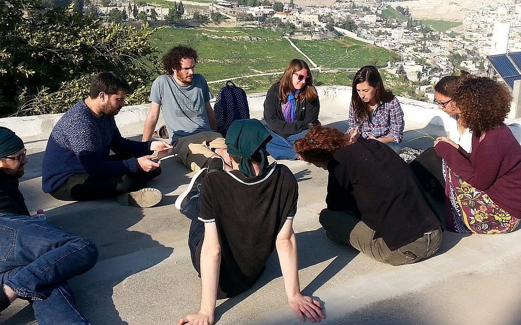 Achvat Amim participants having a rooftop discussion. (Courtesy Achvat Amim)