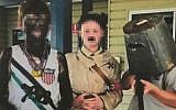 A photo posted by the Rowena Public School in Australia shows students dressed in blackface and an Adolf Hitler costume for a  day at the school to honor historical figures. (Facebook)
