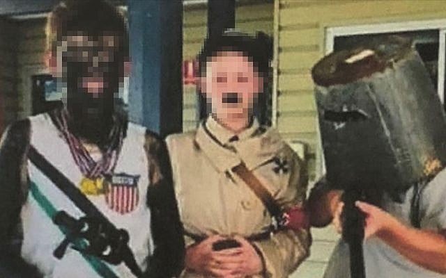 A photo posted by the Rowena Public School in Australia shows students dressed in blackface and an Adolf Hitler costume for a day at the school to honor historical figures. (Facebook) A photo posted by the Rowena Public School in Australia shows students dressed in blackface and an Adolf Hitler costume for a day at the school to honor historical figures. (Facebook)
