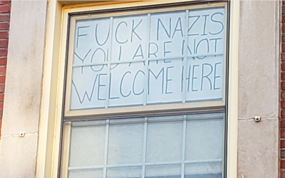 Nicole Parsons, a junior at the University of Massachusetts, Amherst, said she decided to put up this sign after a swastika was drawn over a Happy Hanukkah sign. (Courtesy)