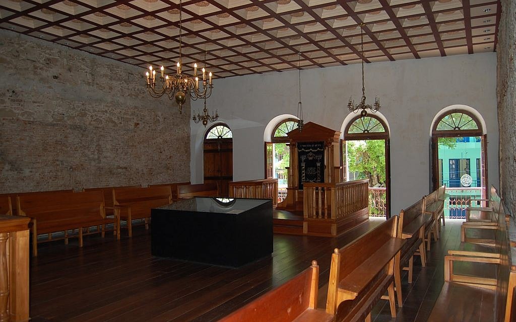 The interior of the Kahal Zur synagogue, once a large Orthodox establishment in Recife, Brazil, that was restored in 2002 as a museum and also contains a small egalitarian shul. (Wikimedia Commons/via JTA)