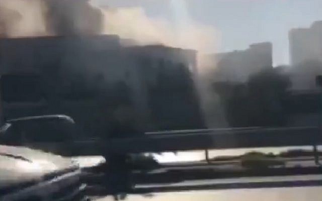 Screen capture from video showing smoke coming from the Foreign Minister building in Tripoli following a suicide bombing, December 25, 2018. (Twitter) Screen capture from video showing smoke coming from the Foreign Minister building in Tripoli following a suicide bombing, December 25, 2018. (Twitter)
